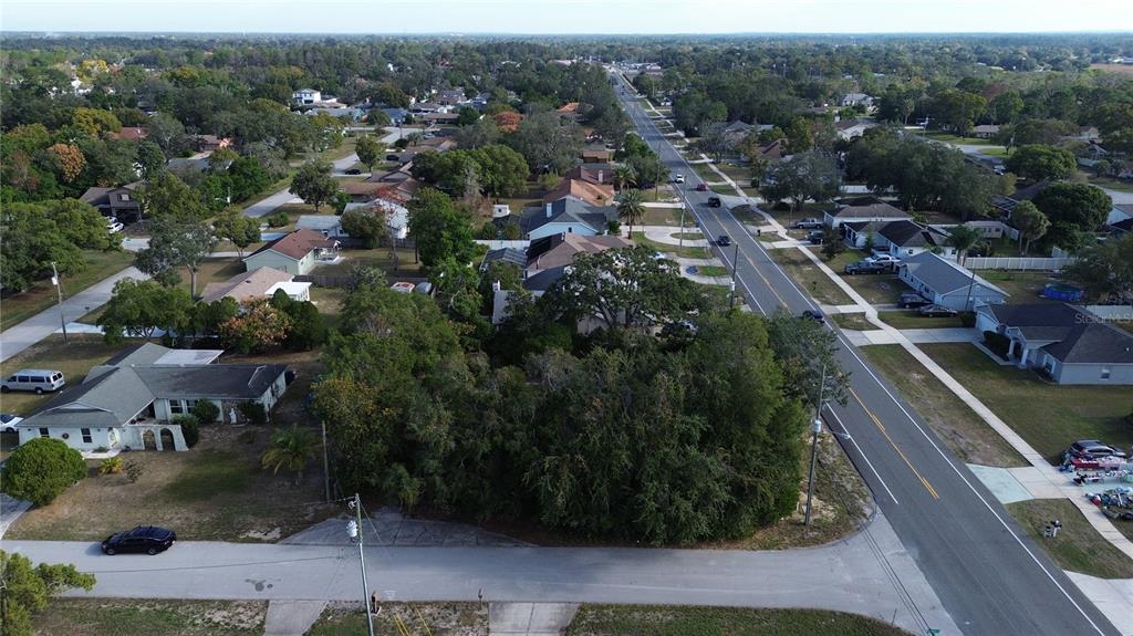 3263 Deltona Boulevard Spring Hill, FL 34606 - Photo 3 of 18 an aerial view of residential houses with outdoor space