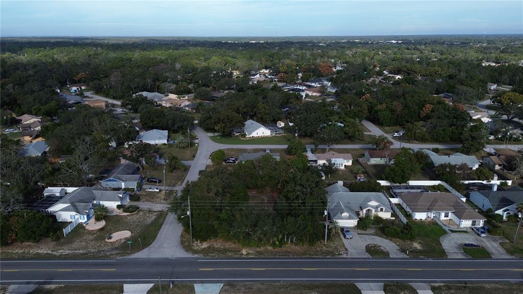 3263 Deltona Boulevard Spring Hill, FL 34606 - Photo 4 of 18 an aerial view of multiple house