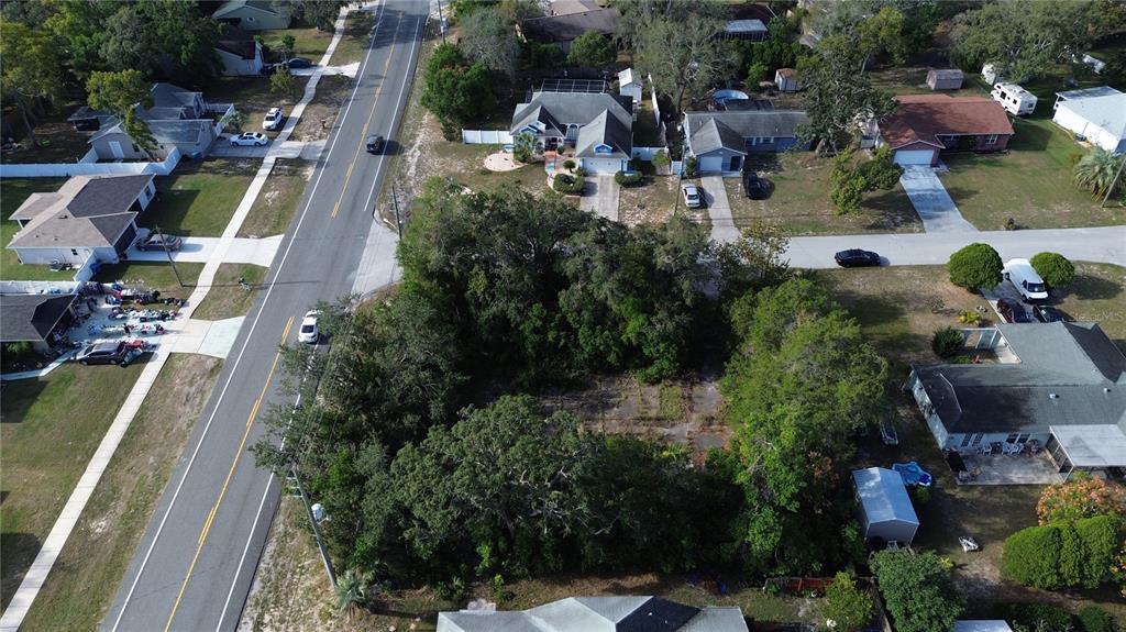 3263 Deltona Boulevard Spring Hill, FL 34606 - Photo 6 of 18 an aerial view of a house with outdoor space pool seating area and yard
