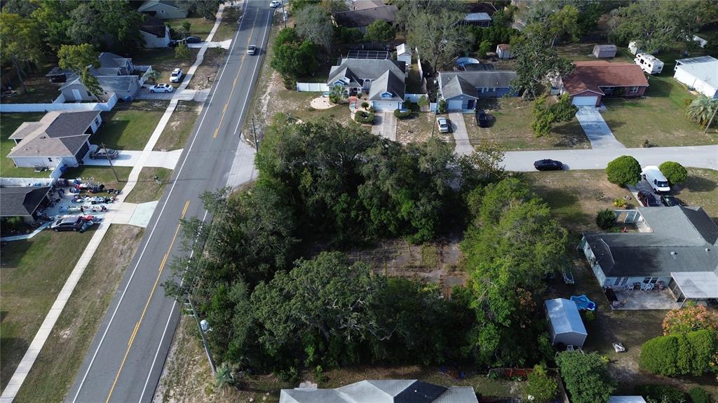 3263 Deltona Boulevard Spring Hill, FL 34606 - Photo 7 of 18 an aerial view of a house with outdoor space pool seating area and yard