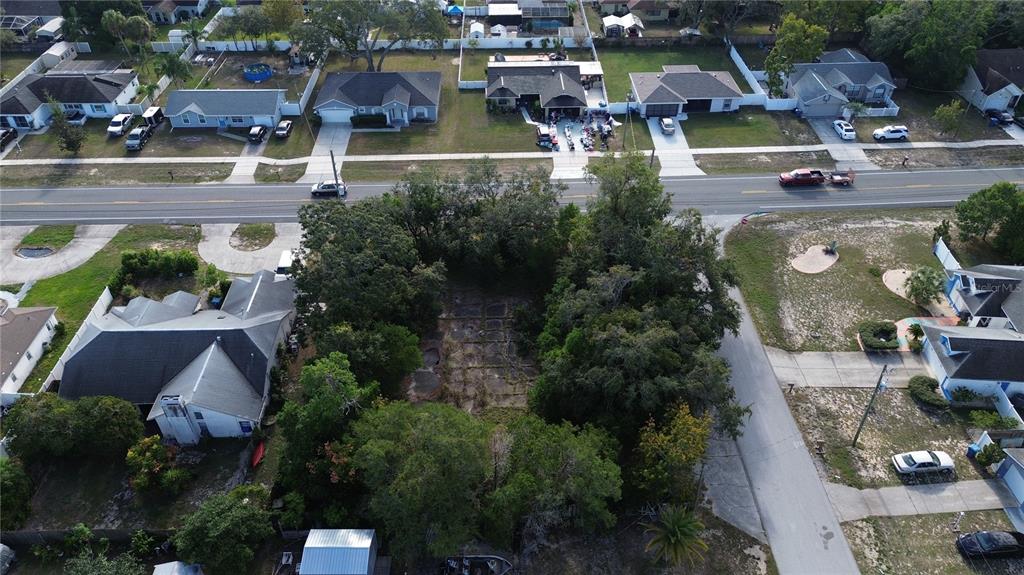 3263 Deltona Boulevard Spring Hill, FL 34606 - Photo 8 of 18 an aerial view of residential houses with outdoor space