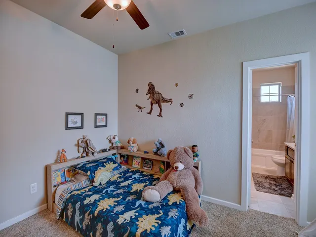 a bed room with a bed and a chandelier