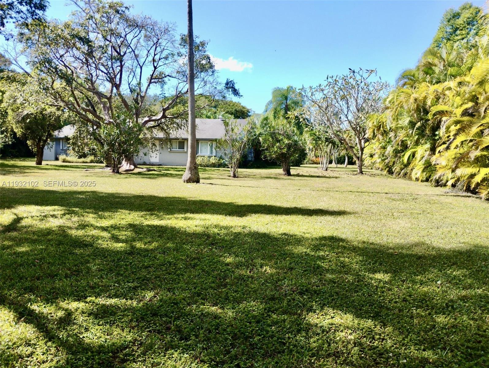 16021 Southwest 173rd Avenue Miami, FL 33187 - Photo 15 of 30 a view of a swimming pool with an outdoor space and seating area