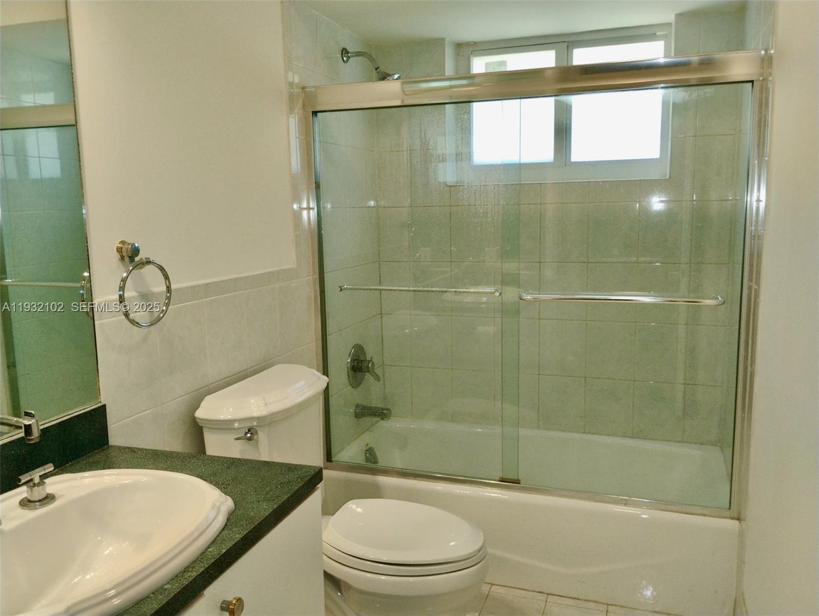 16021 Southwest 173rd Avenue Miami, FL 33187 - Photo 20 of 30 a bathroom with a sink a toilet and shower