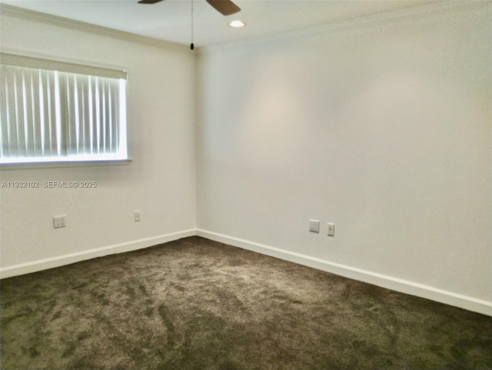 16021 Southwest 173rd Avenue Miami, FL 33187 - Photo 23 of 30 an empty room with a window