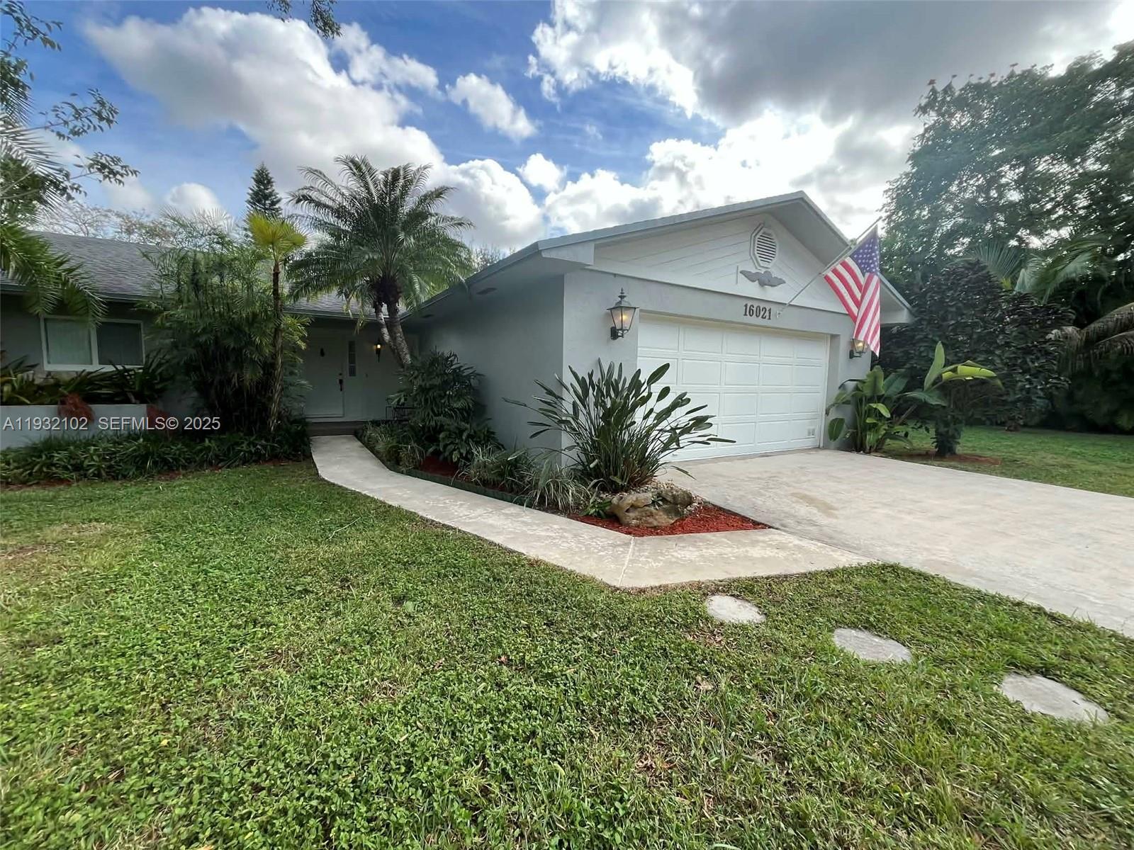 16021 Southwest 173rd Avenue Miami, FL 33187 - Photo 5 of 30 a view of a house with a yard