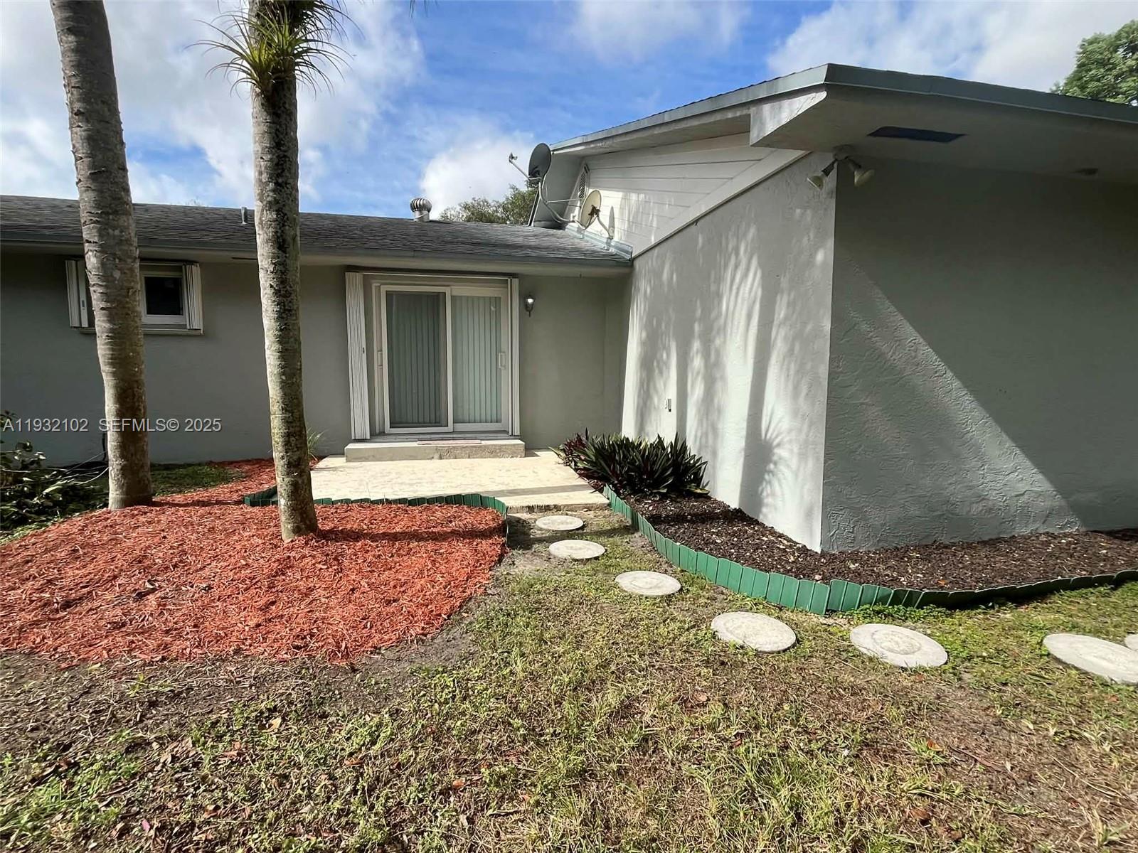 16021 Southwest 173rd Avenue Miami, FL 33187 - Photo 7 of 30 a view of a house with backyard