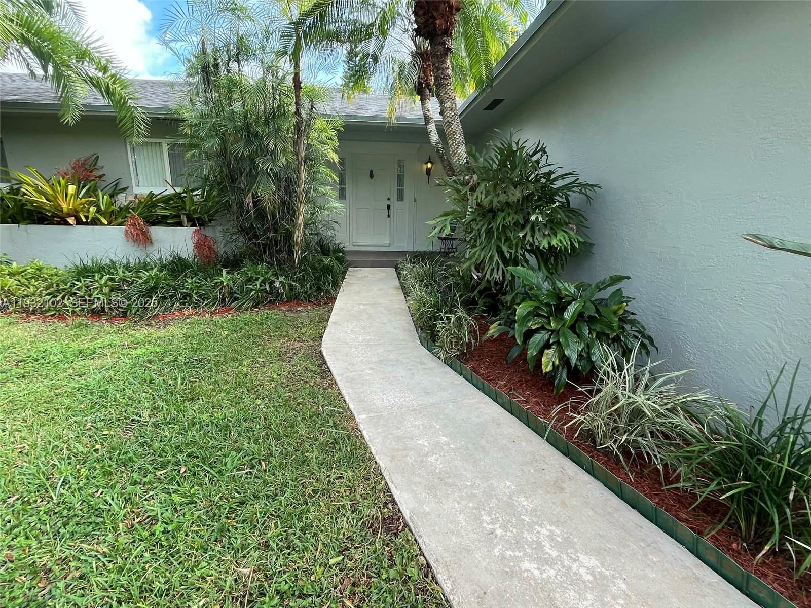 16021 Southwest 173rd Avenue Miami, FL 33187 - Photo 10 of 30 a view of a garden with plants