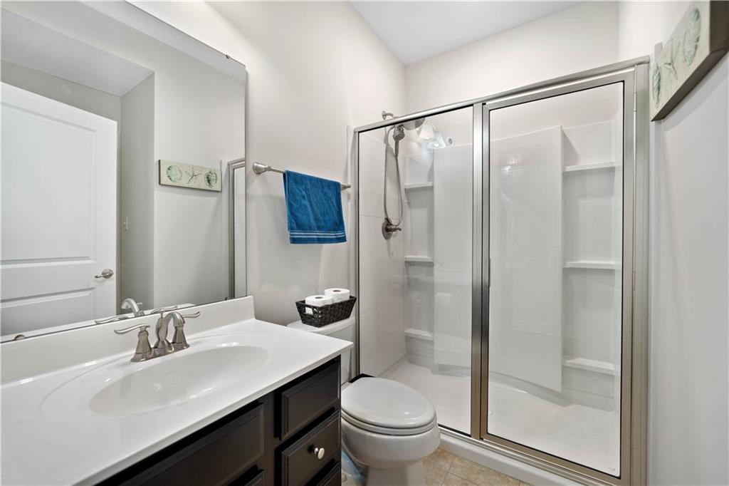 4449 Walnut Ridge Circle McDonald, PA 15057 - Photo 17 of 40 a bathroom with a sink toilet a mirror and shower