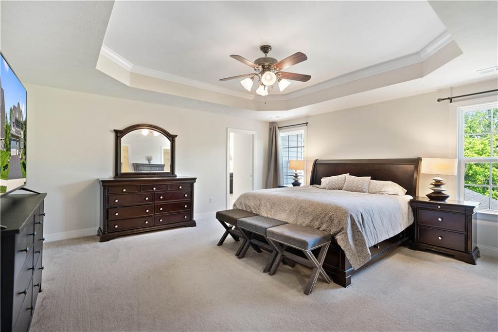 4449 Walnut Ridge Circle McDonald, PA 15057 - Photo 18 of 40 a spacious bedroom with a bed and a dresser