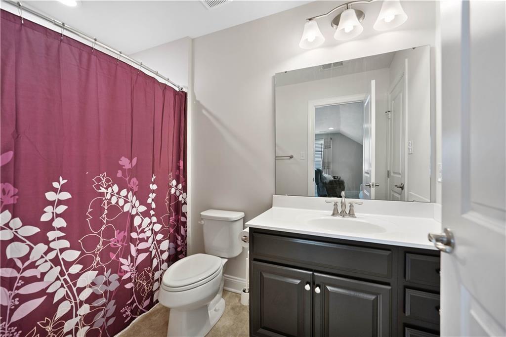 4449 Walnut Ridge Circle McDonald, PA 15057 - Photo 27 of 40 a bathroom with a sink vanity mirror and toilet