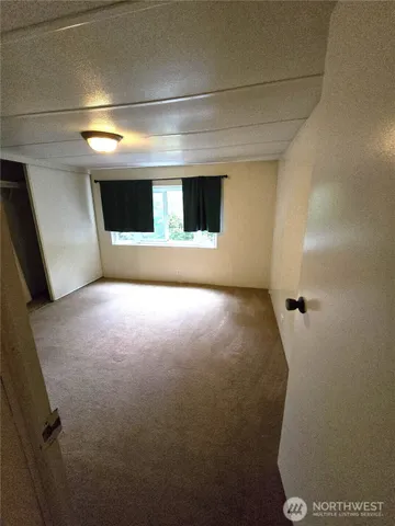 a view of a swimming pool with an outdoor space and seating area