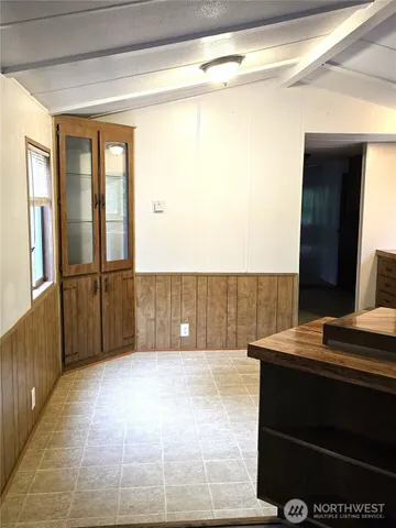 a view of bathroom with a sink and a mirror