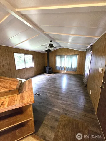 a view of hallway with wooden floor