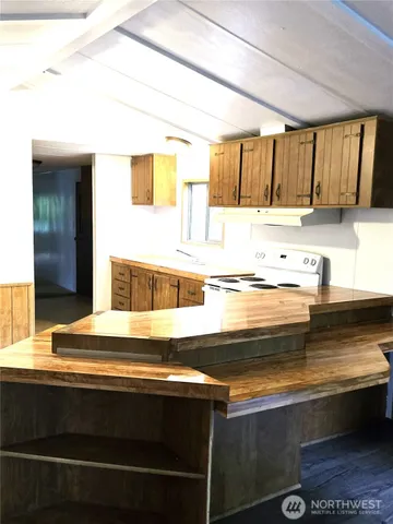 a kitchen with a stove and a sink