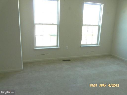 78 Glenbrook Road Ranson, WV 25438 - Photo 8 of 17 an empty room with a window