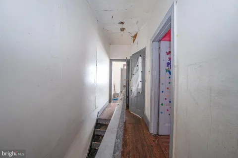a view of a hallway with a chandelier