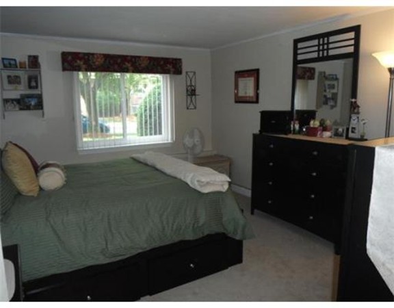 5 Hallmark Gardens, Unit 1 Burlington, MA 01803 - Photo 13 of 15 a bedroom with a bed and window