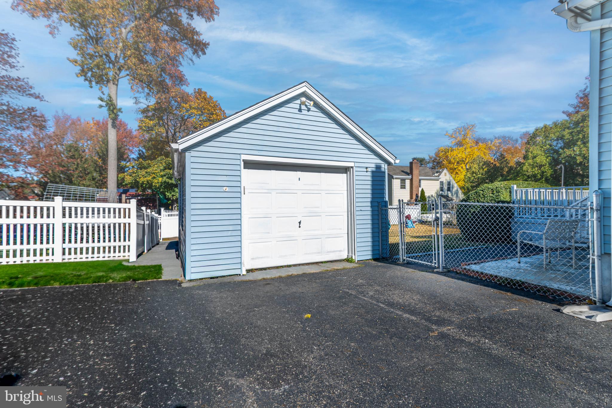 340 High Street Woodbury, NJ 08096 - Photo 2 of 14 a view of a house with a small yard and wooden fence