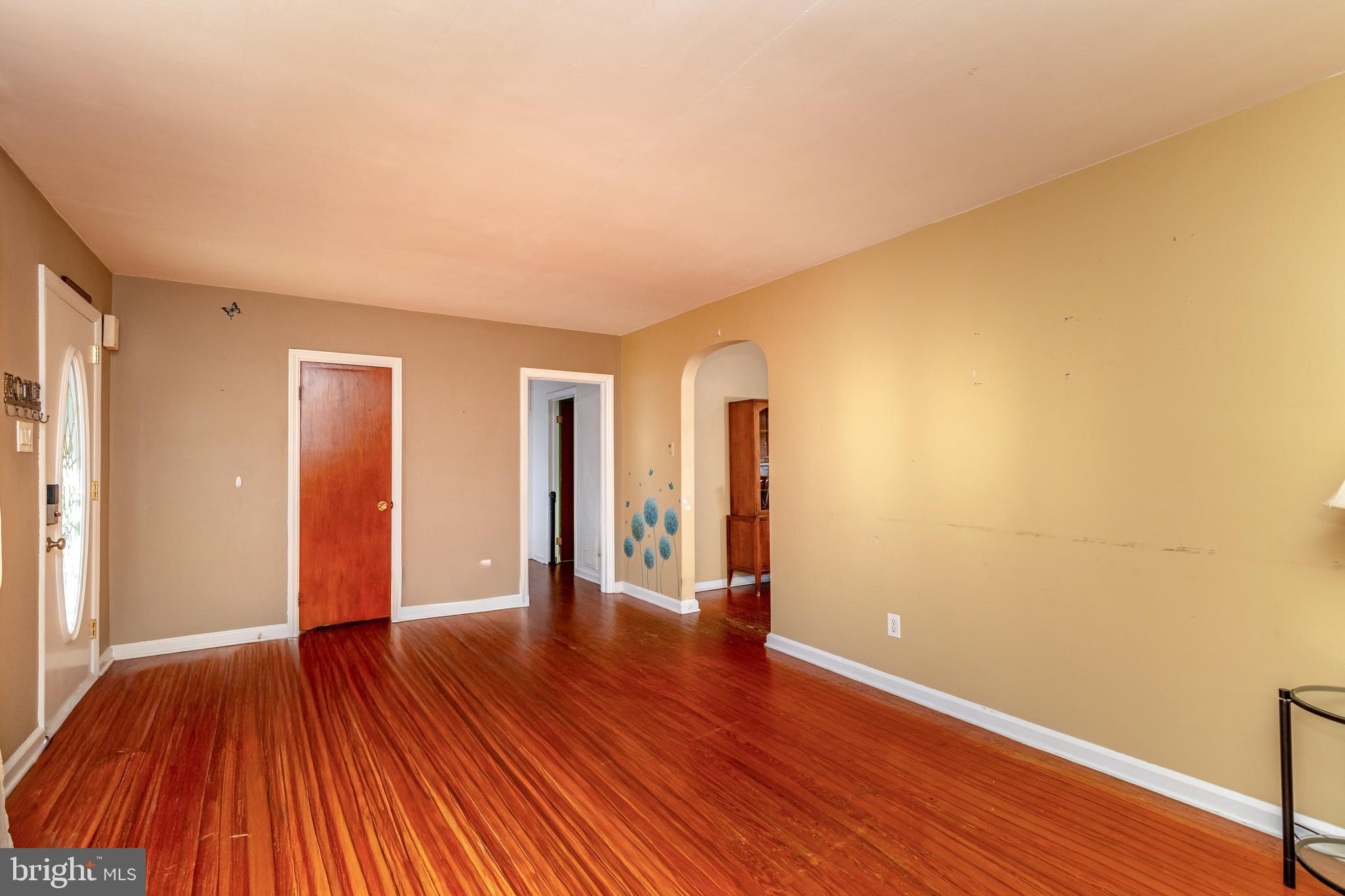 340 High Street Woodbury, NJ 08096 - Photo 3 of 14 a view of an empty room with wooden floor
