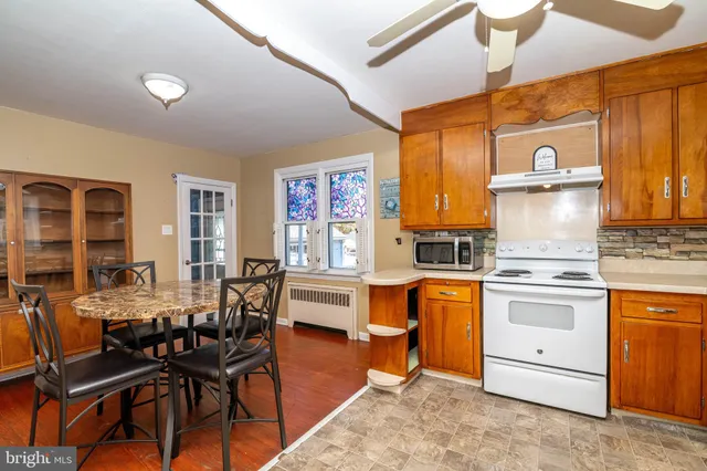 a kitchen with stainless steel appliances granite countertop a stove and a refrigerator
