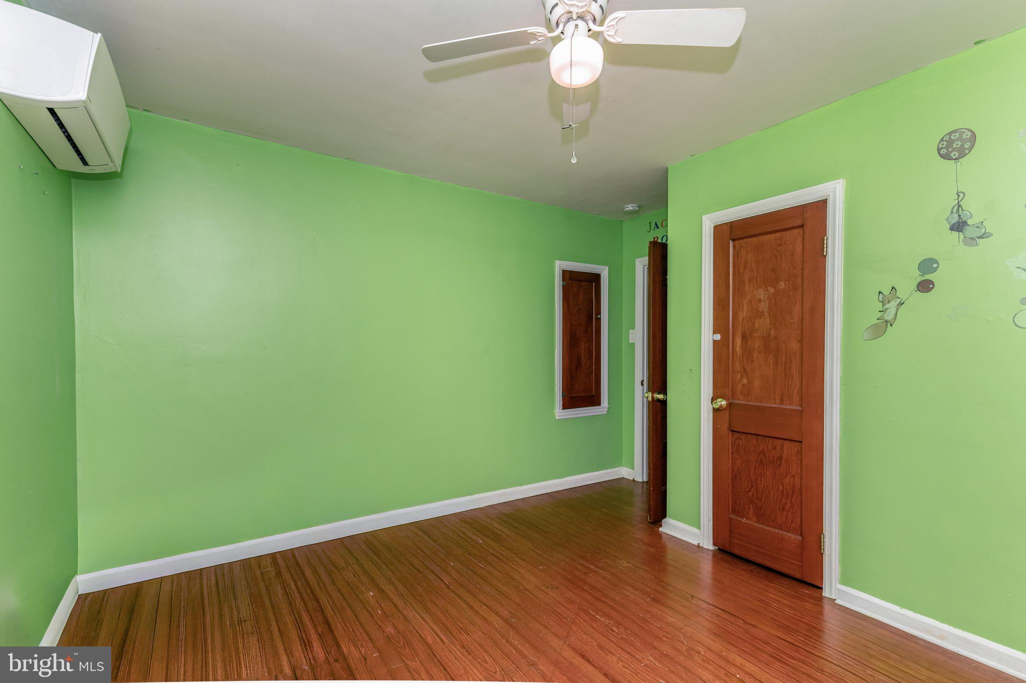 340 High Street Woodbury, NJ 08096 - Photo 8 of 14 a view of empty room with wooden floor and fan