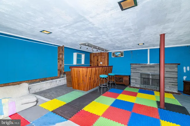 a bedroom with a bed and a book shelf