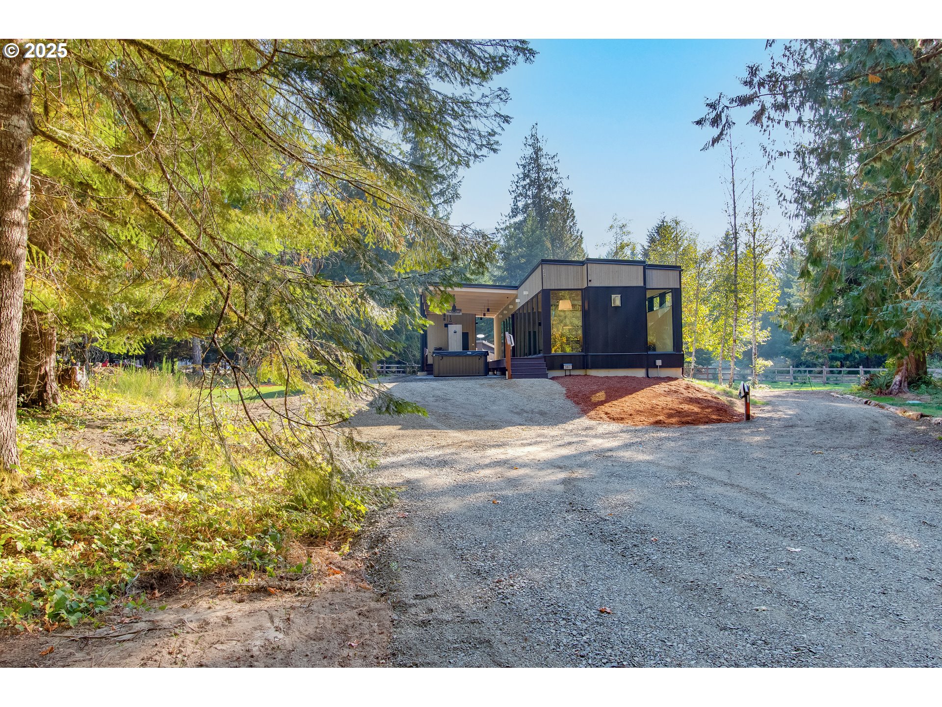 288 Baker Road Randle, WA 98377 - Photo 25 of 48 a view of a house with backyard and tree