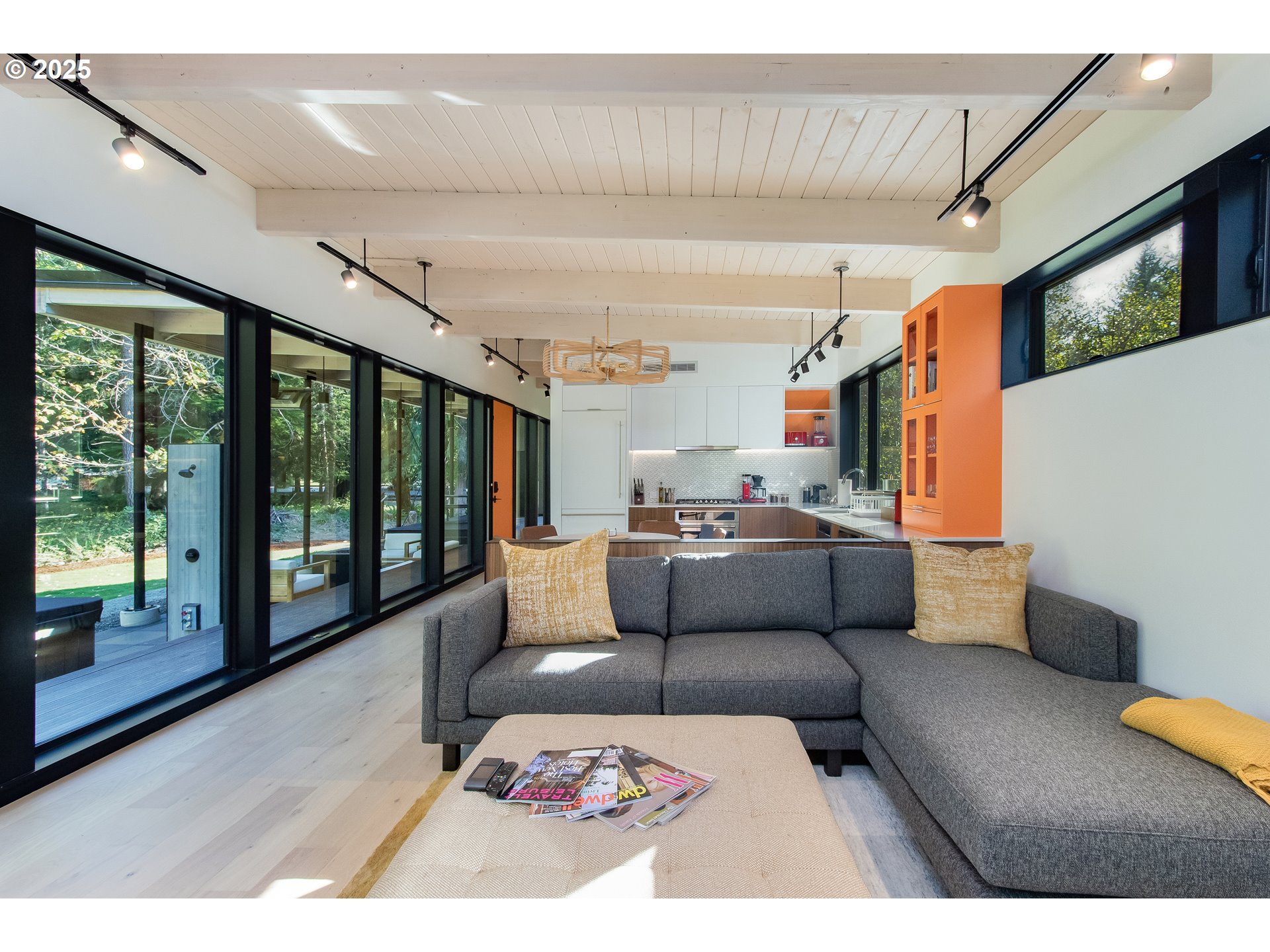288 Baker Road Randle, WA 98377 - Photo 28 of 48 a living room with furniture and a floor to ceiling window