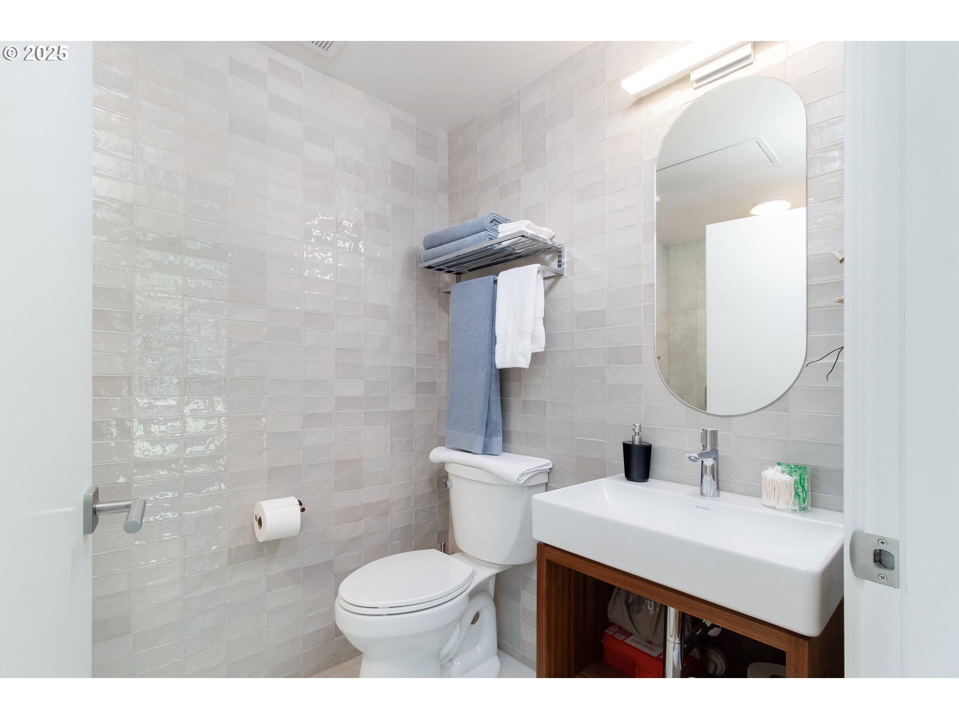 288 Baker Road Randle, WA 98377 - Photo 36 of 48 a bathroom with a sink mirror and toilet