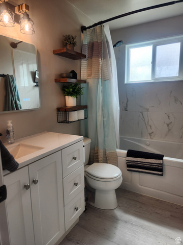 705 North 700 East Payson, UT 84651 - Photo 13 of 30 Full bath featuring vanity, light wood-style flooring, and shower / tub combo with curtain