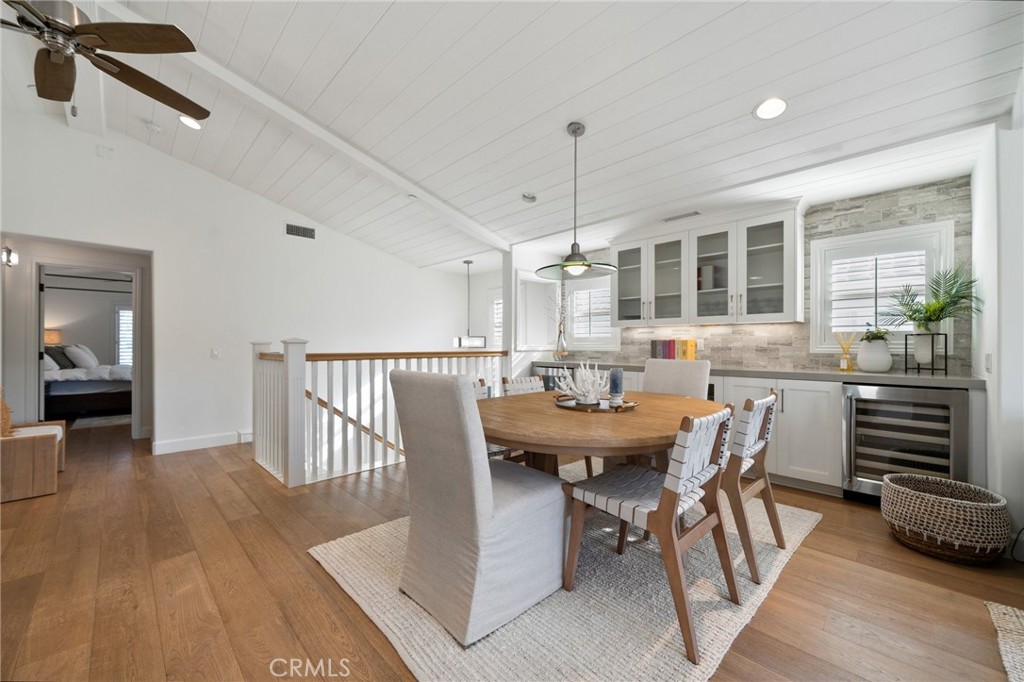 33 Cassis Dana Point, CA 92629 - Photo 11 of 49 a view of a dining room and livingroom with furniture wooden floor a chandelier