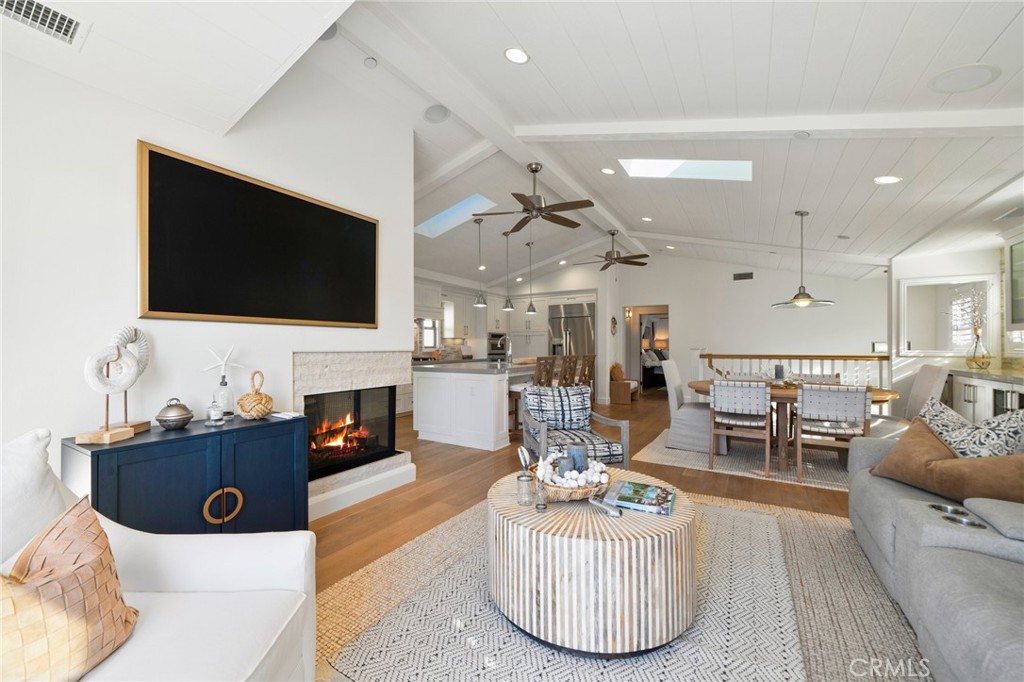 33 Cassis Dana Point, CA 92629 - Photo 16 of 49 a living room with fireplace furniture and a flat screen tv