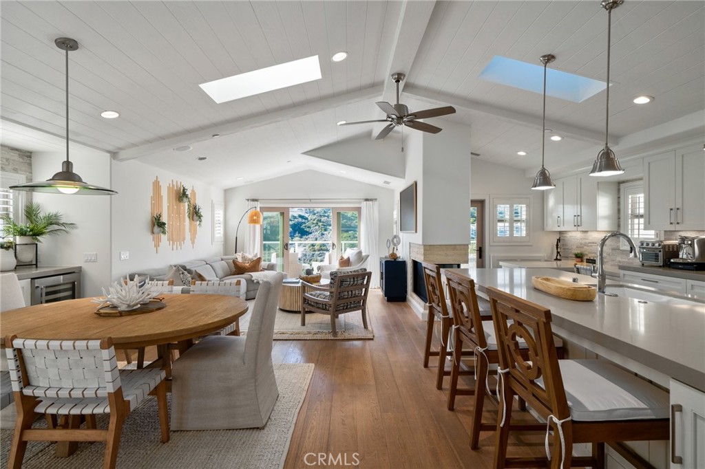 33 Cassis Dana Point, CA 92629 - Photo 17 of 49 a view of a dining room and livingroom with furniture wooden floor a chandelier