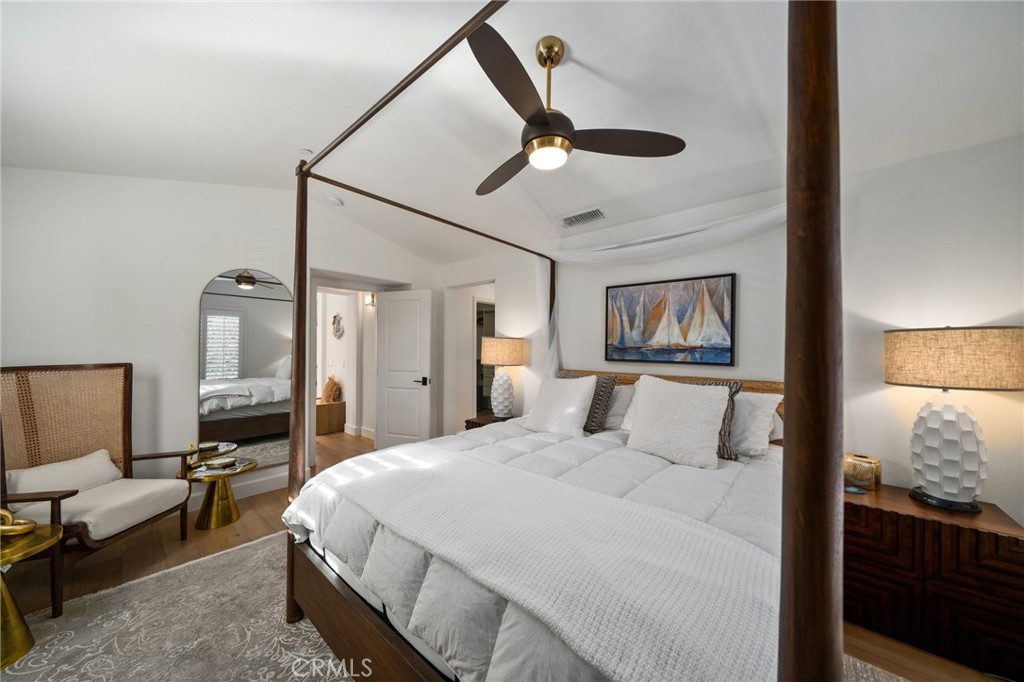 33 Cassis Dana Point, CA 92629 - Photo 19 of 49 a bedroom with a bed and a painting on the wall