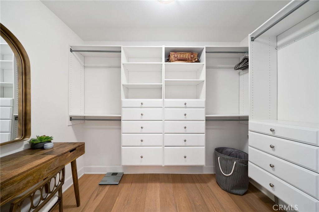 33 Cassis Dana Point, CA 92629 - Photo 22 of 49 a view of a closet with wooden floor
