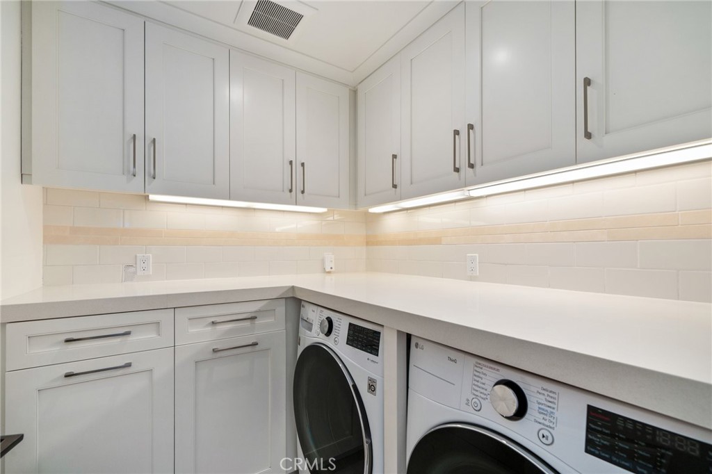 33 Cassis Dana Point, CA 92629 - Photo 30 of 49 a utility room with dryer and washer