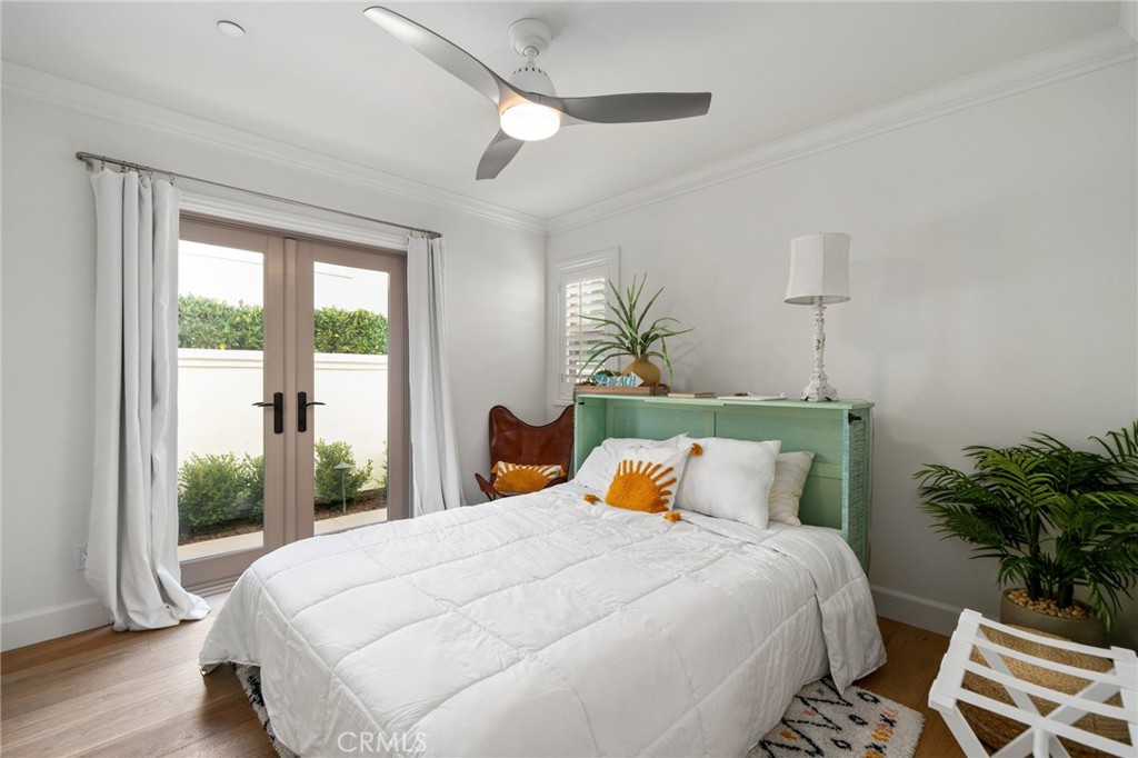 33 Cassis Dana Point, CA 92629 - Photo 31 of 49 a bedroom with a large bed and a potted plant