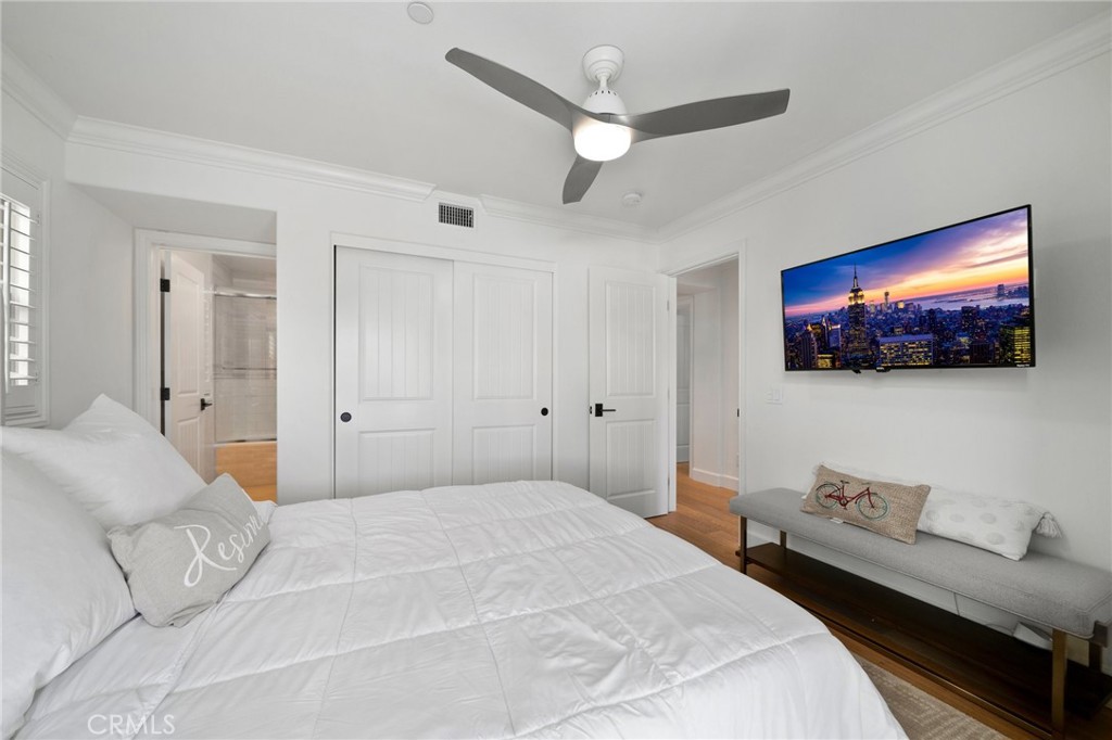 33 Cassis Dana Point, CA 92629 - Photo 34 of 49 a bedroom with a bed and a flat screen tv