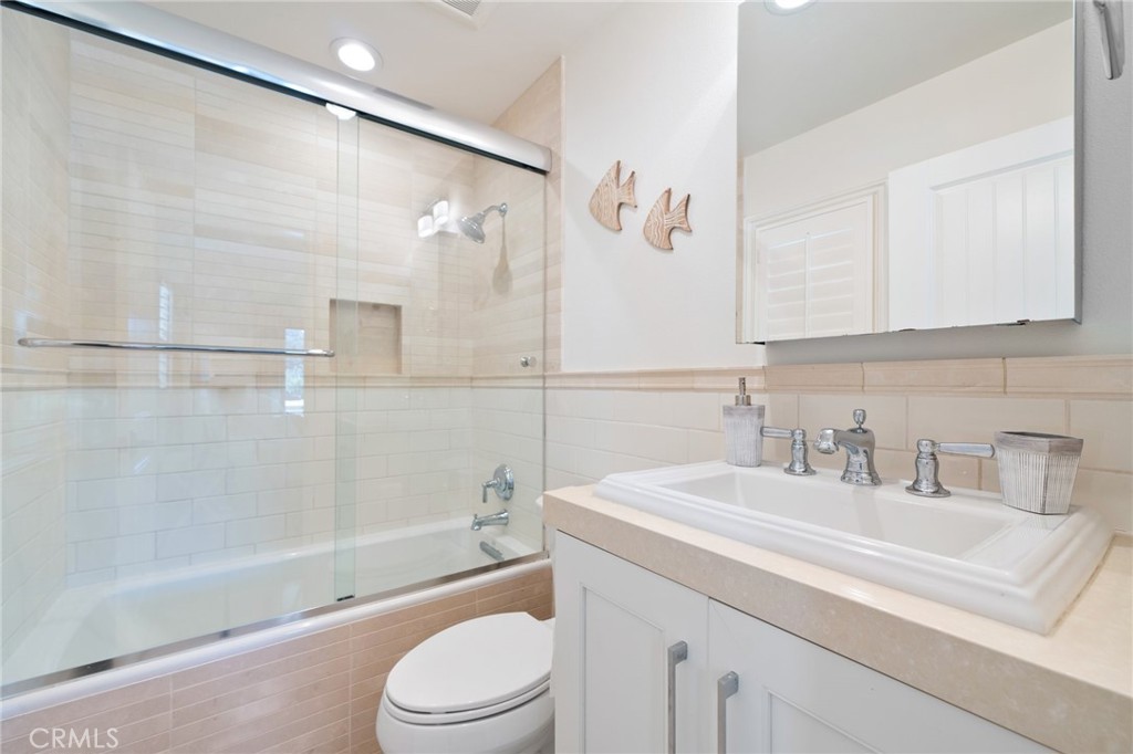 33 Cassis Dana Point, CA 92629 - Photo 35 of 49 a bathroom with a sink a toilet and shower