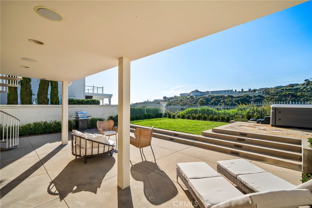 33 Cassis Dana Point, CA 92629 - Photo 40 of 49 a view of swimming pool with seating area and trees in the background