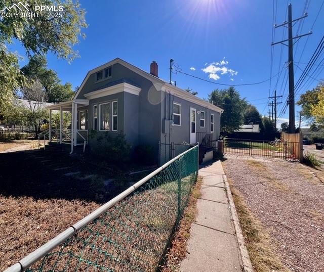 1819 East Yampa Street Colorado Springs, CO 80909 - Photo 20 of 25 a front view of a house with a yard