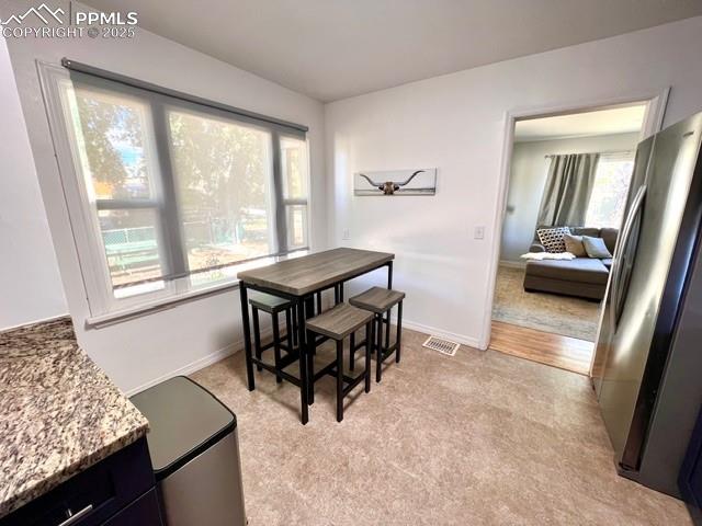 1819 East Yampa Street Colorado Springs, CO 80909 - Photo 9 of 25 a view of a workspace with furniture and a window
