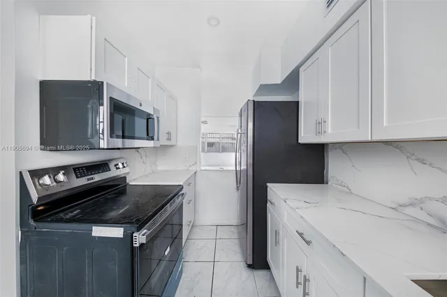 a kitchen with a stove microwave and refrigerator