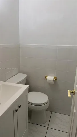 a bathroom with a toilet and a sink