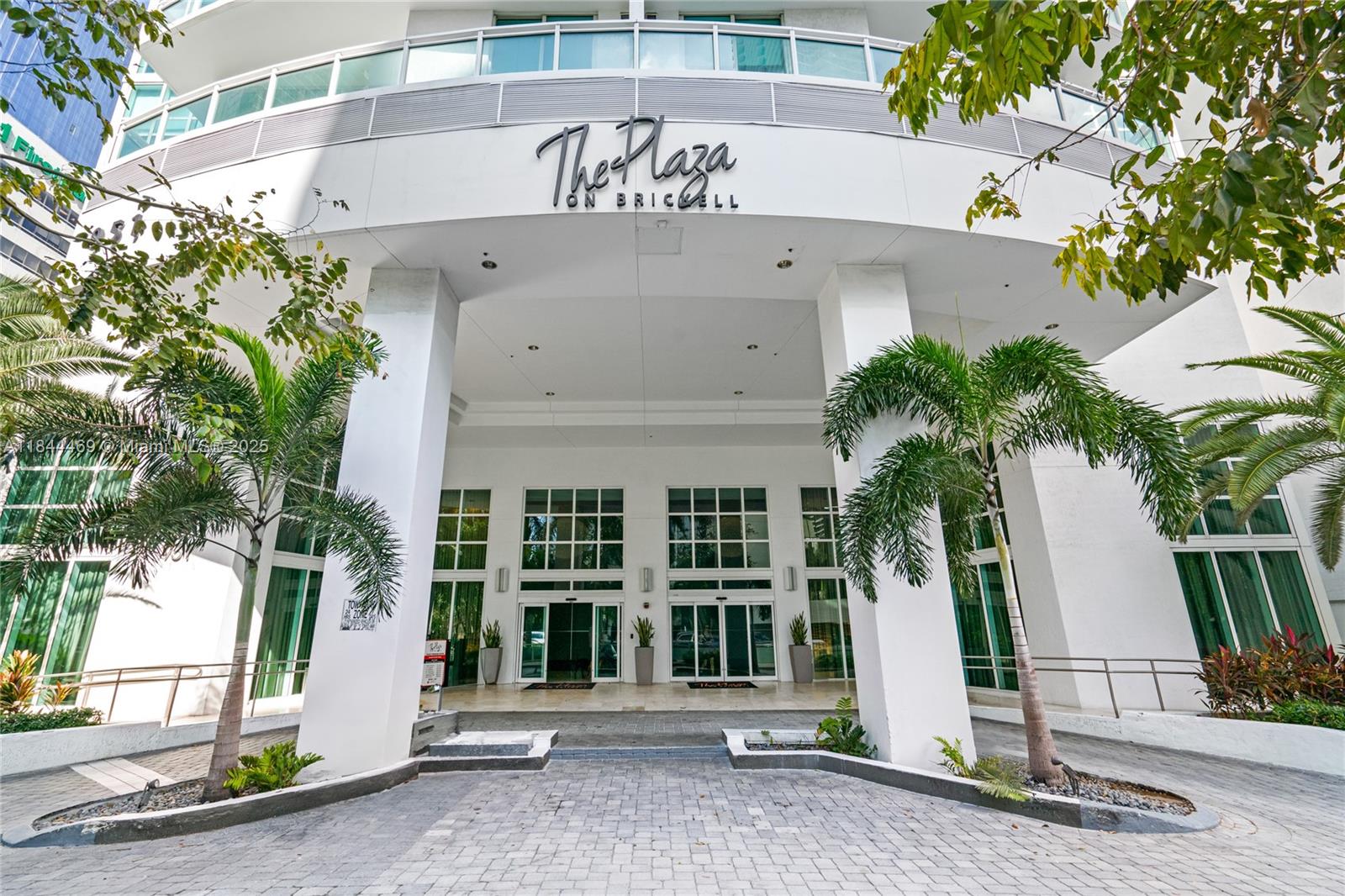 951 Brickell Avenue, Unit 1505 Miami, FL 33131 - Photo 2 of 48 a front view of a house with a garage