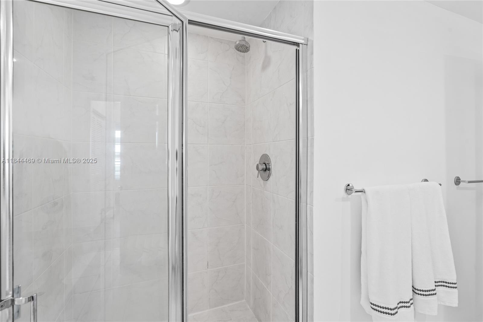 951 Brickell Avenue, Unit 1505 Miami, FL 33131 - Photo 30 of 48 a bathroom with a glass shower door