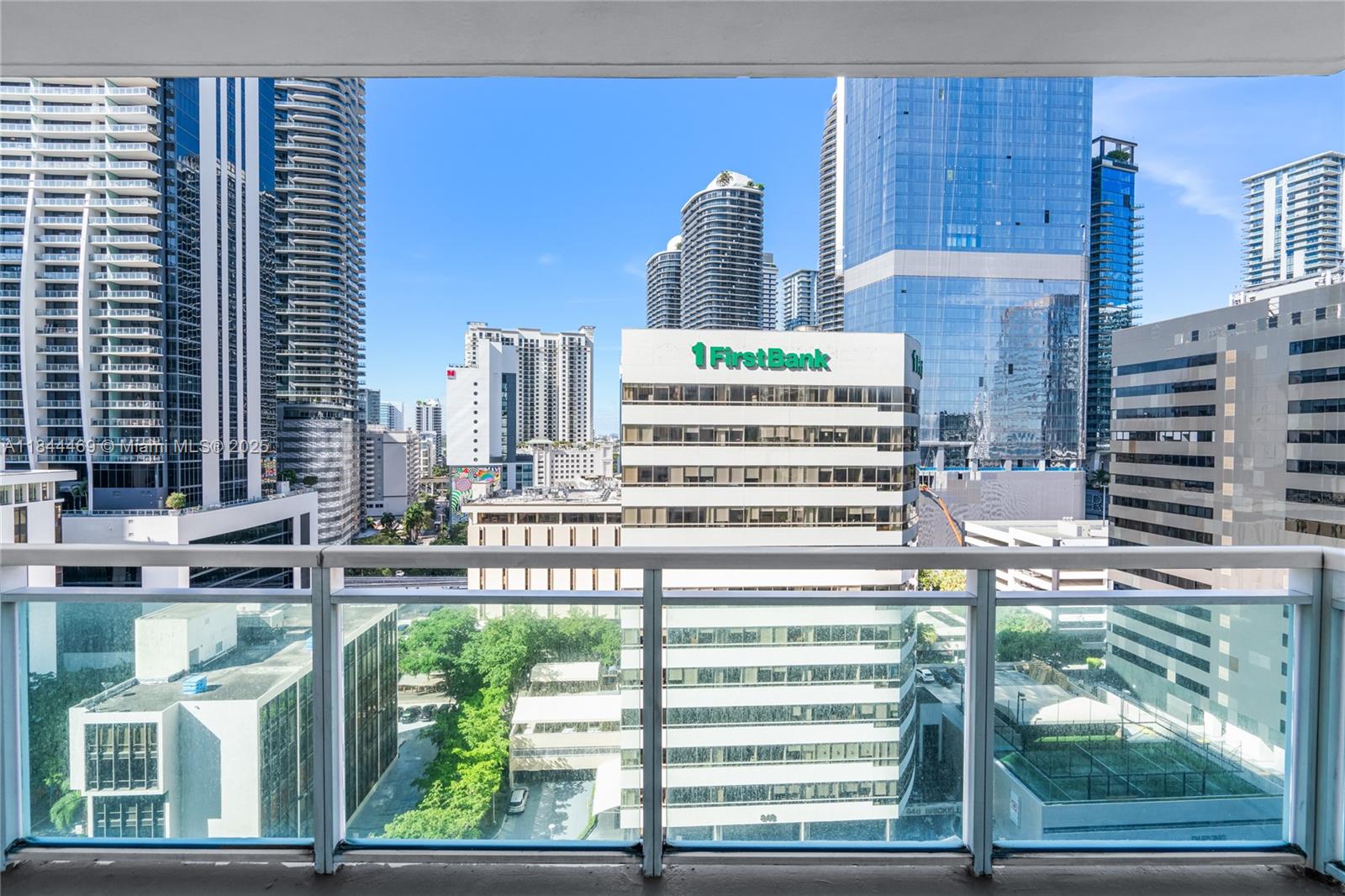 951 Brickell Avenue, Unit 1505 Miami, FL 33131 - Photo 3 of 48 a front view of a building with glass windows