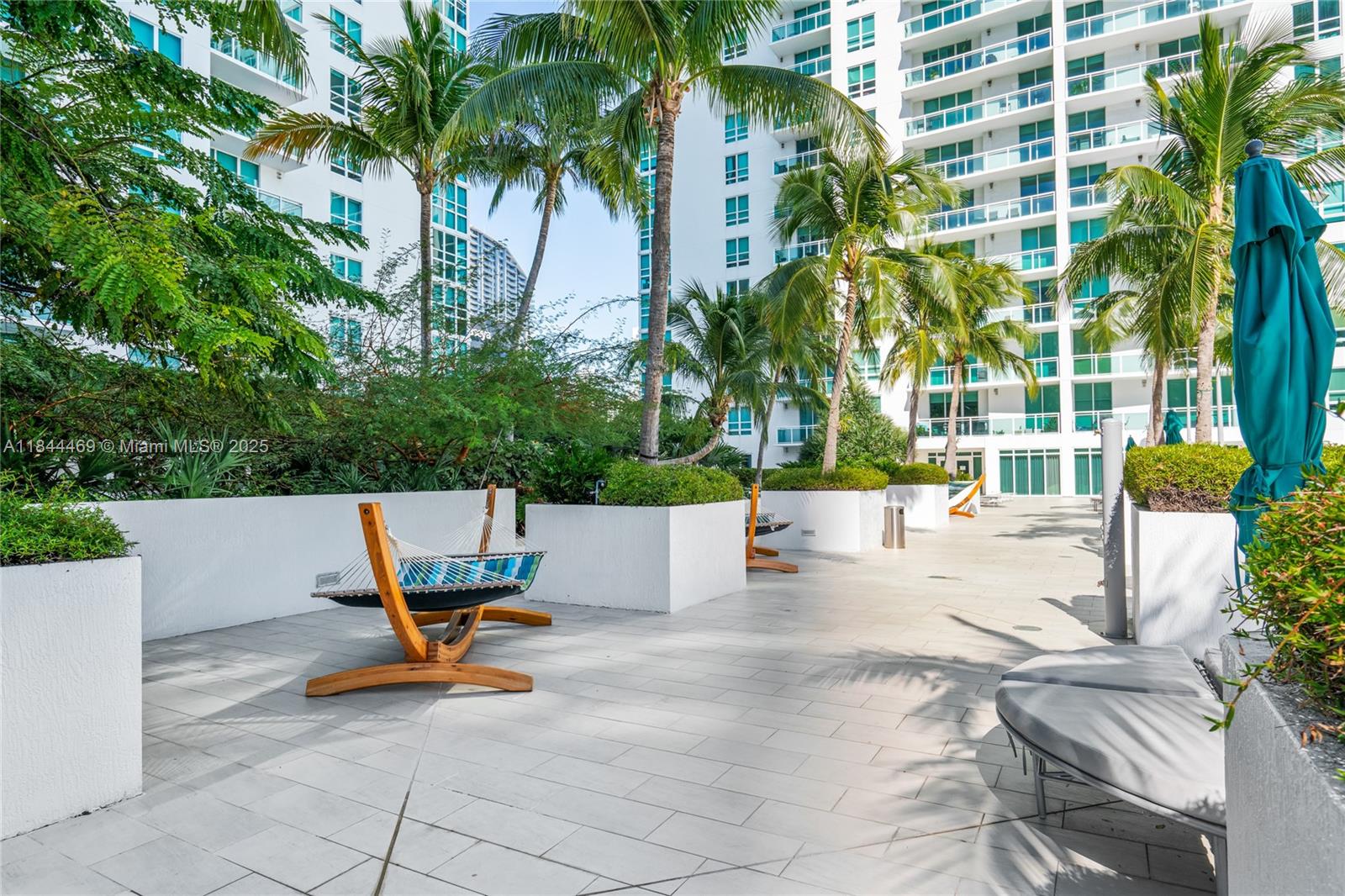 951 Brickell Avenue, Unit 1505 Miami, FL 33131 - Photo 38 of 48 a view of a swimming pool with a lounge chairs