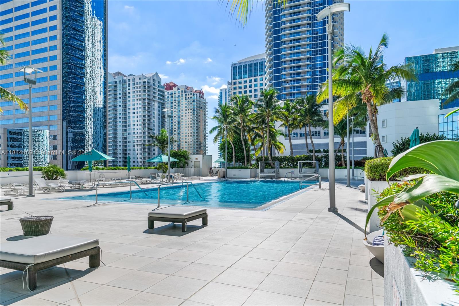 951 Brickell Avenue, Unit 1505 Miami, FL 33131 - Photo 39 of 48 a swimming pool with outdoor seating and yard